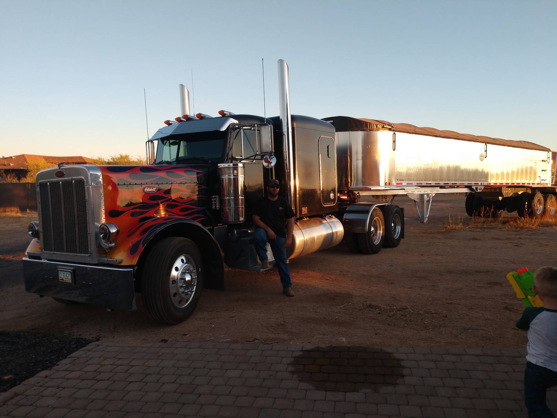 Soards Trucking custom Peterbilt with flame paint job at golden hour in the Arizona desert
