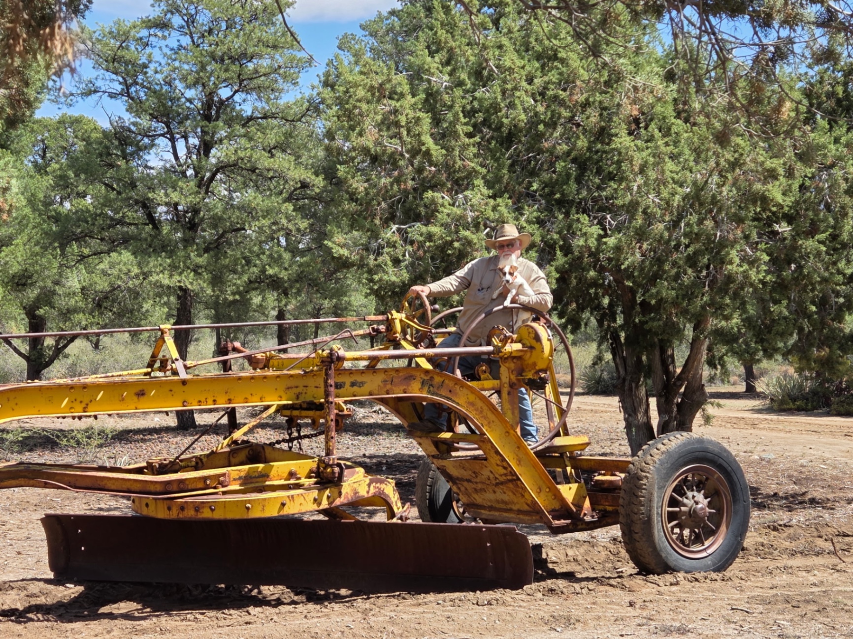 Shane Soards operating a vintage grader on a family jobsite in northern Arizona